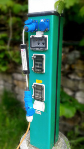 electrical supply post on marina shown with plug in galvanic isolator connected to protect the boats hull from corrosion